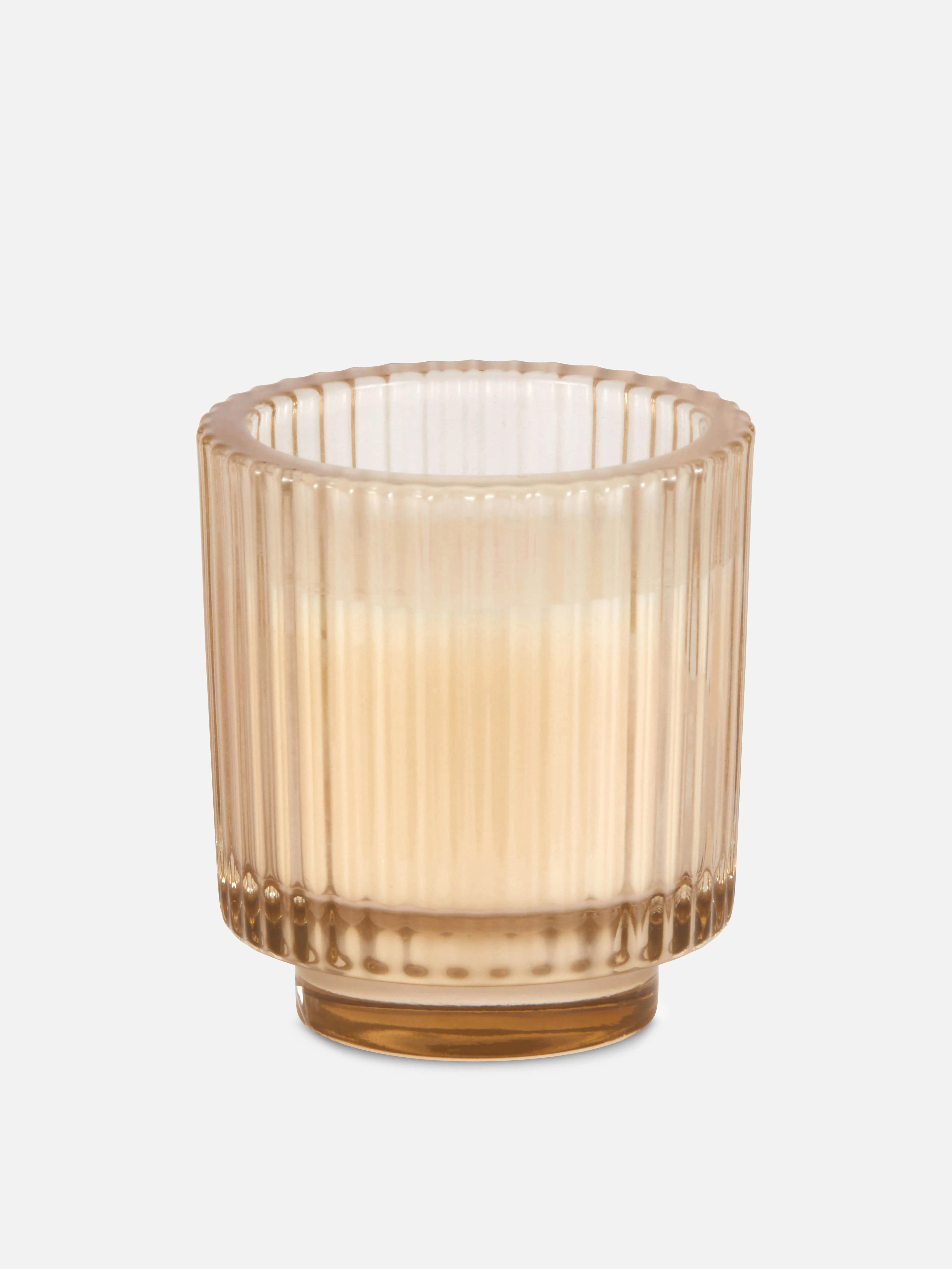 Vela en vaso de vidrio estriado
